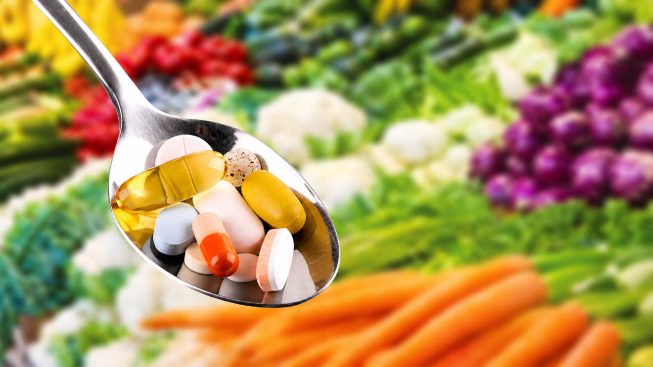 Your Simple Wellness Stack: 6 Daily Habits For Everyday Health 7 Spoon Filled With Assorted Supplements Representing Vitamin D3, Omega-3, Magnesium, And Creatine, Shown In Sharp Focus Against A Blurred Colorful Vegetable Market Background.